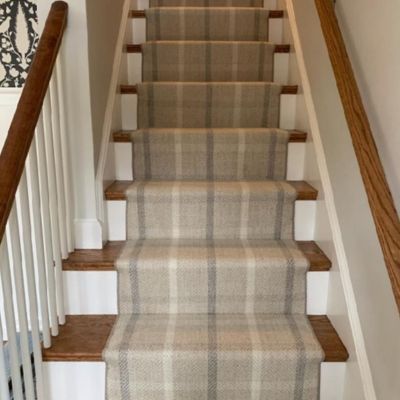 striped neutral stair runner installation in a Quincy, MA, home